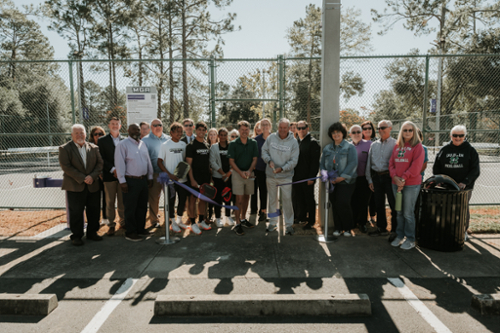 MGA and Dublin representatives pose for a photo at the ribbon cutting event. 